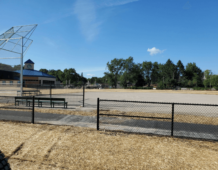 A baseball field with a chain link fence surrounding it