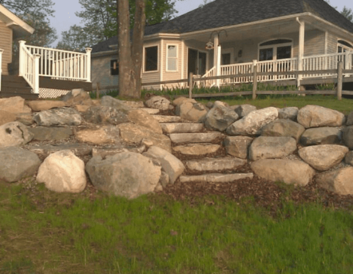 A house with a porch and stairs leading up to it