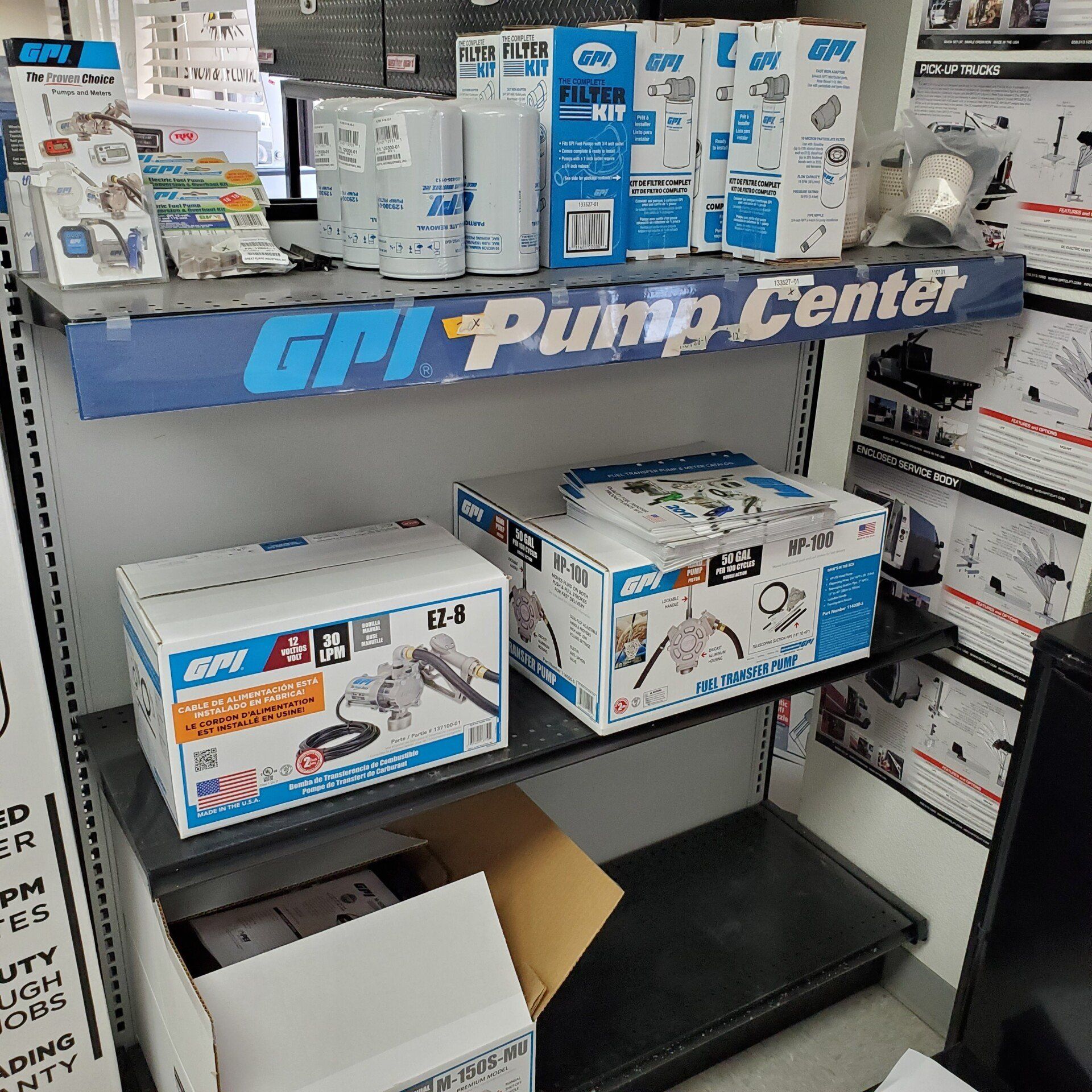 A store shelf displays GPI pump kits and filters in a 