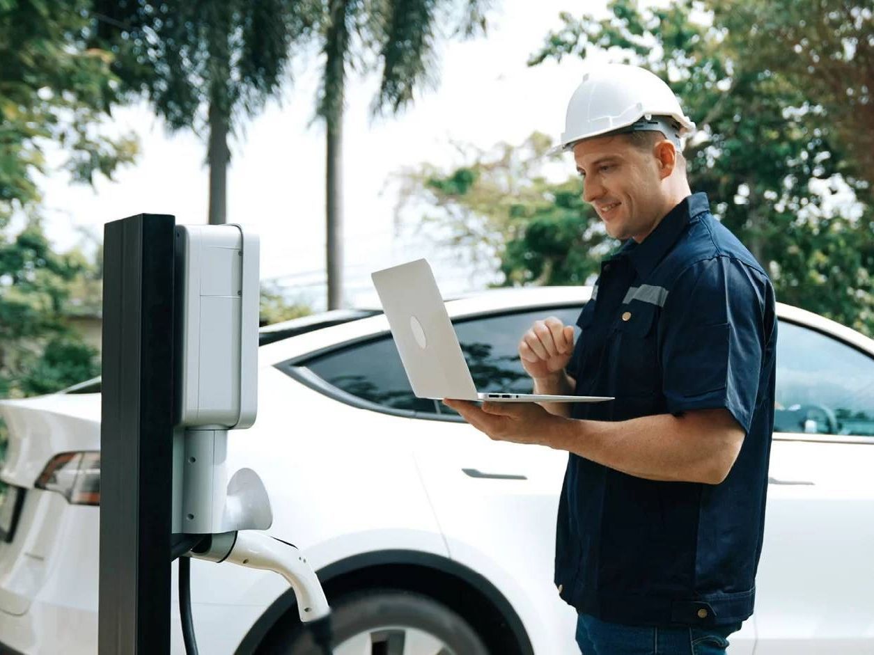 electrician inspecting a newly installed electrical panel