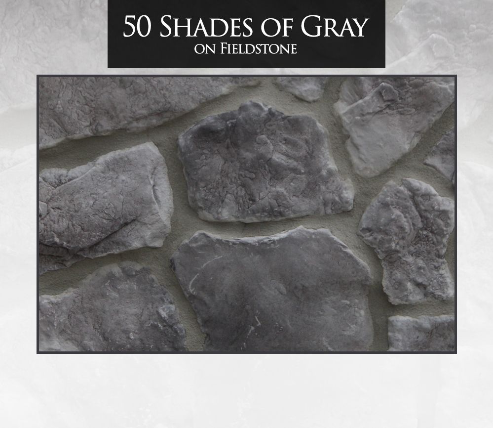 Gray fieldstone, textured, with varying shades, set in mortar. 