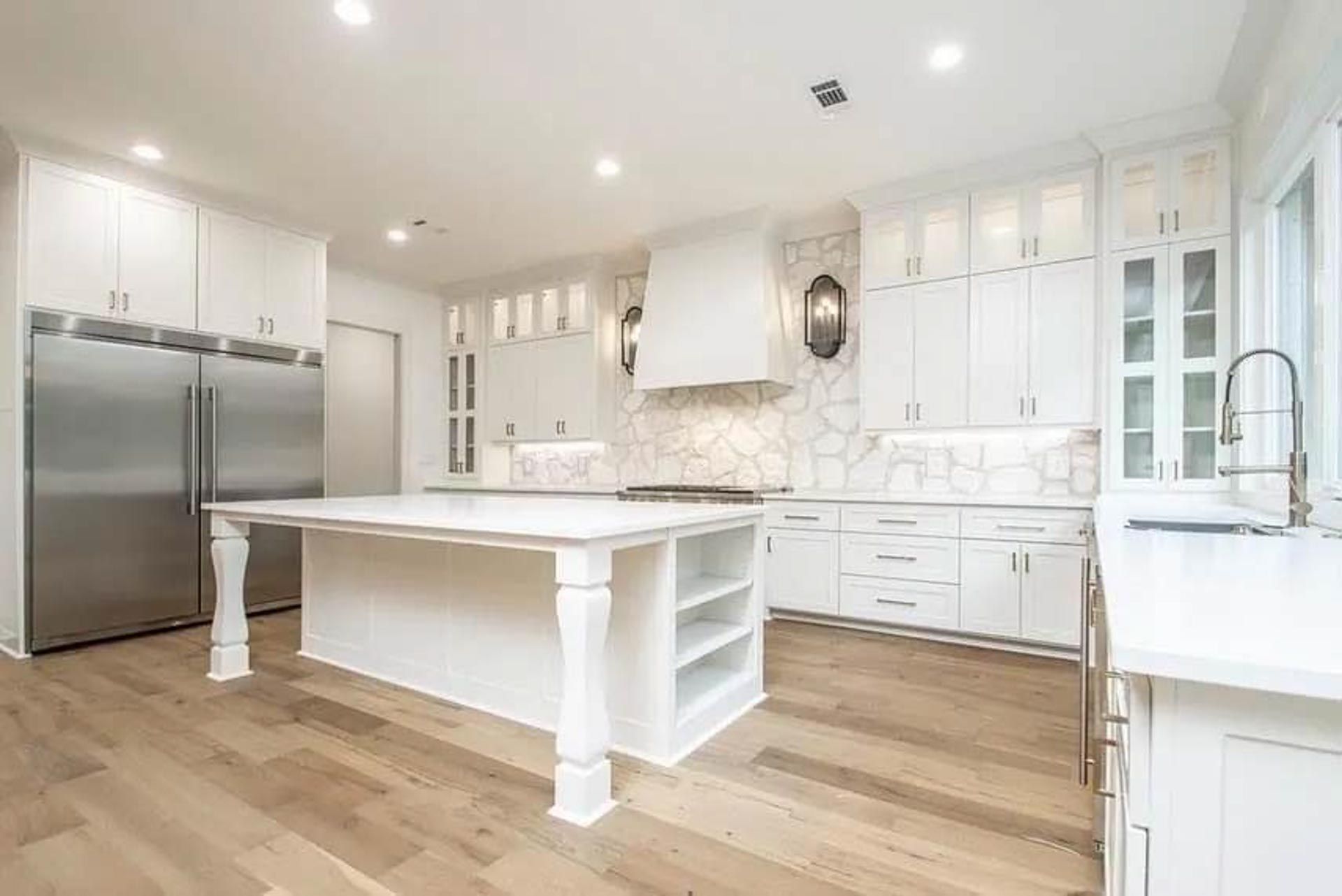 There is a large island in the middle of the kitchen.
