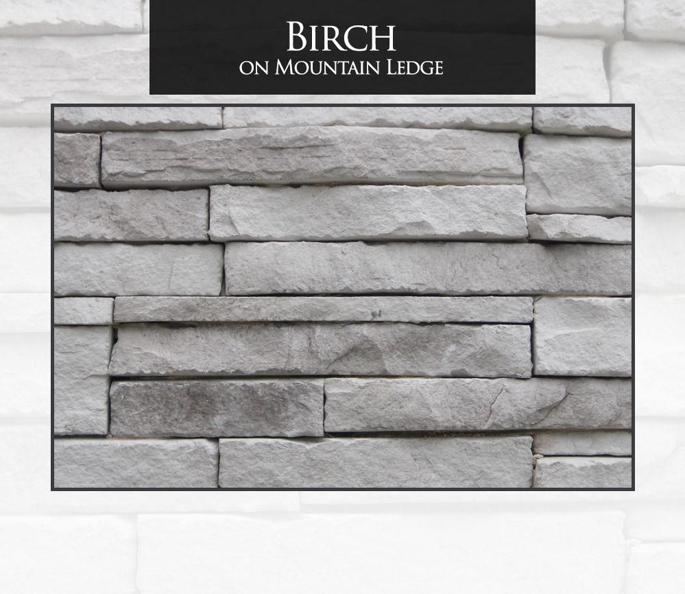Birch-colored mountain ledge stone wall, varying shades of gray and white, rectangular blocks.