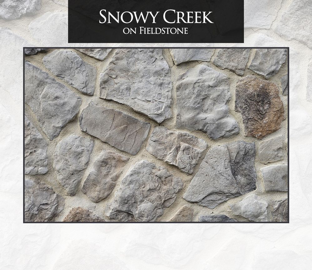 A picture of a stone wall that says snowy creek on fieldstone
