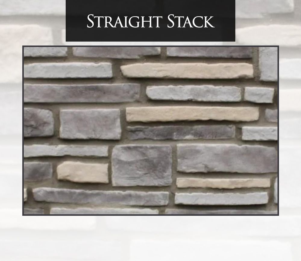 A picture of a straight stack stone wall