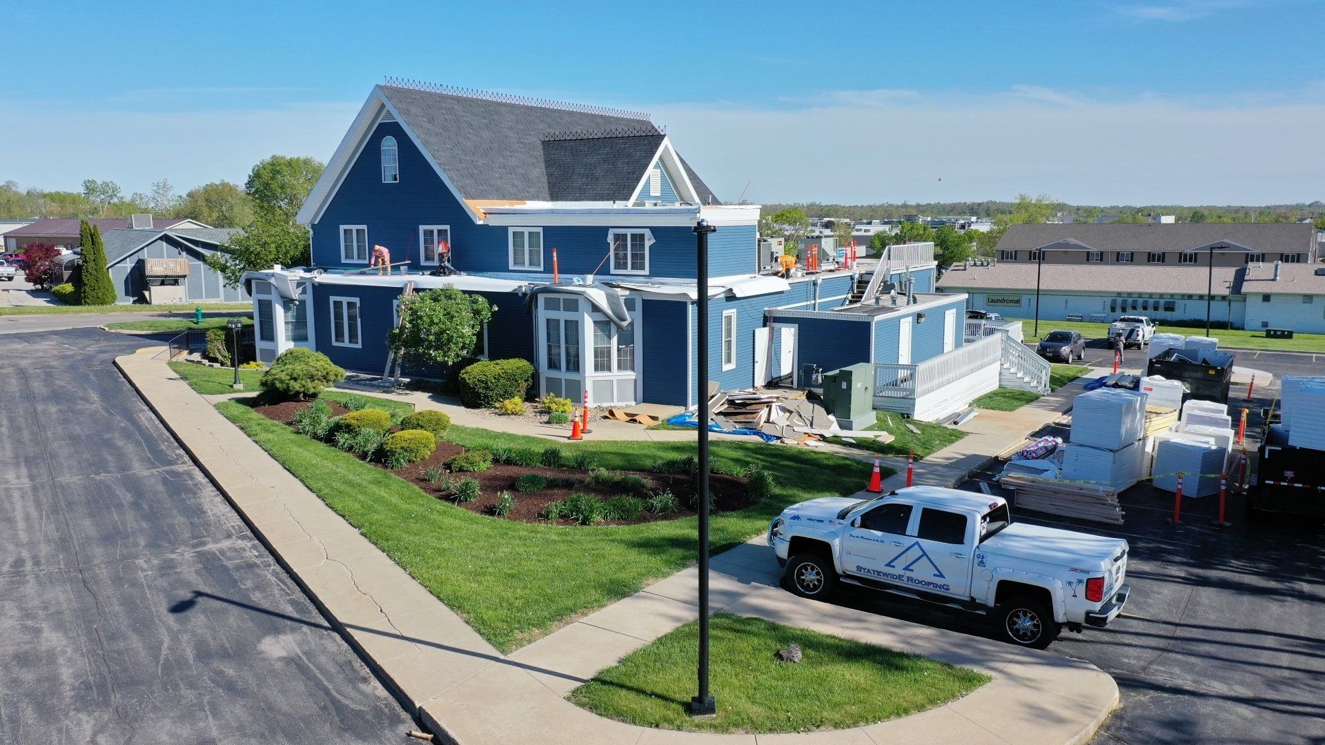 an aerial view of a house under construction with a truck parked in front of it .
