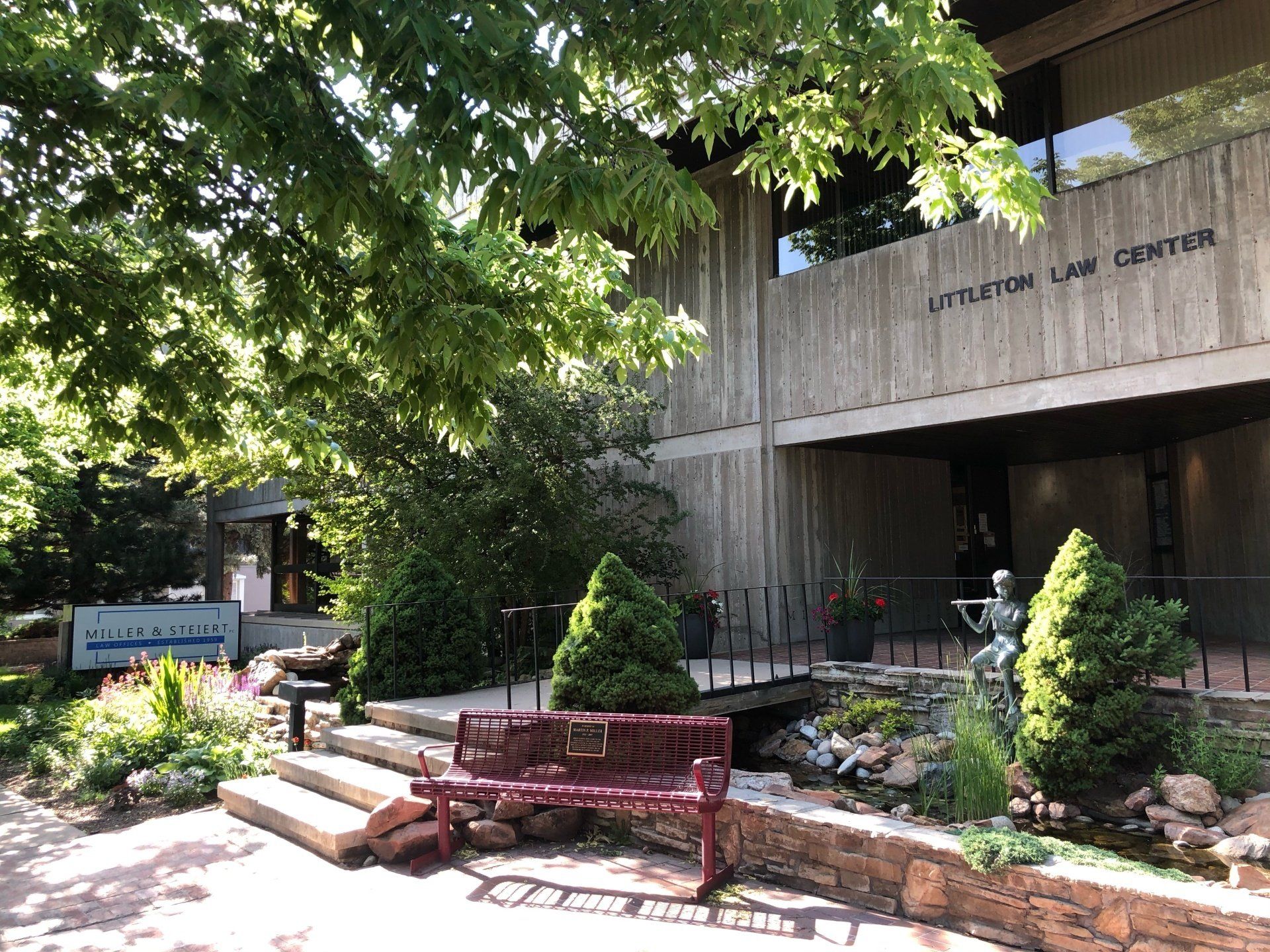 a building with a red bench in front