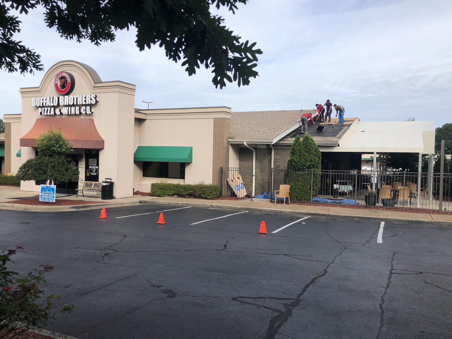 a building with a roof that is being repaired