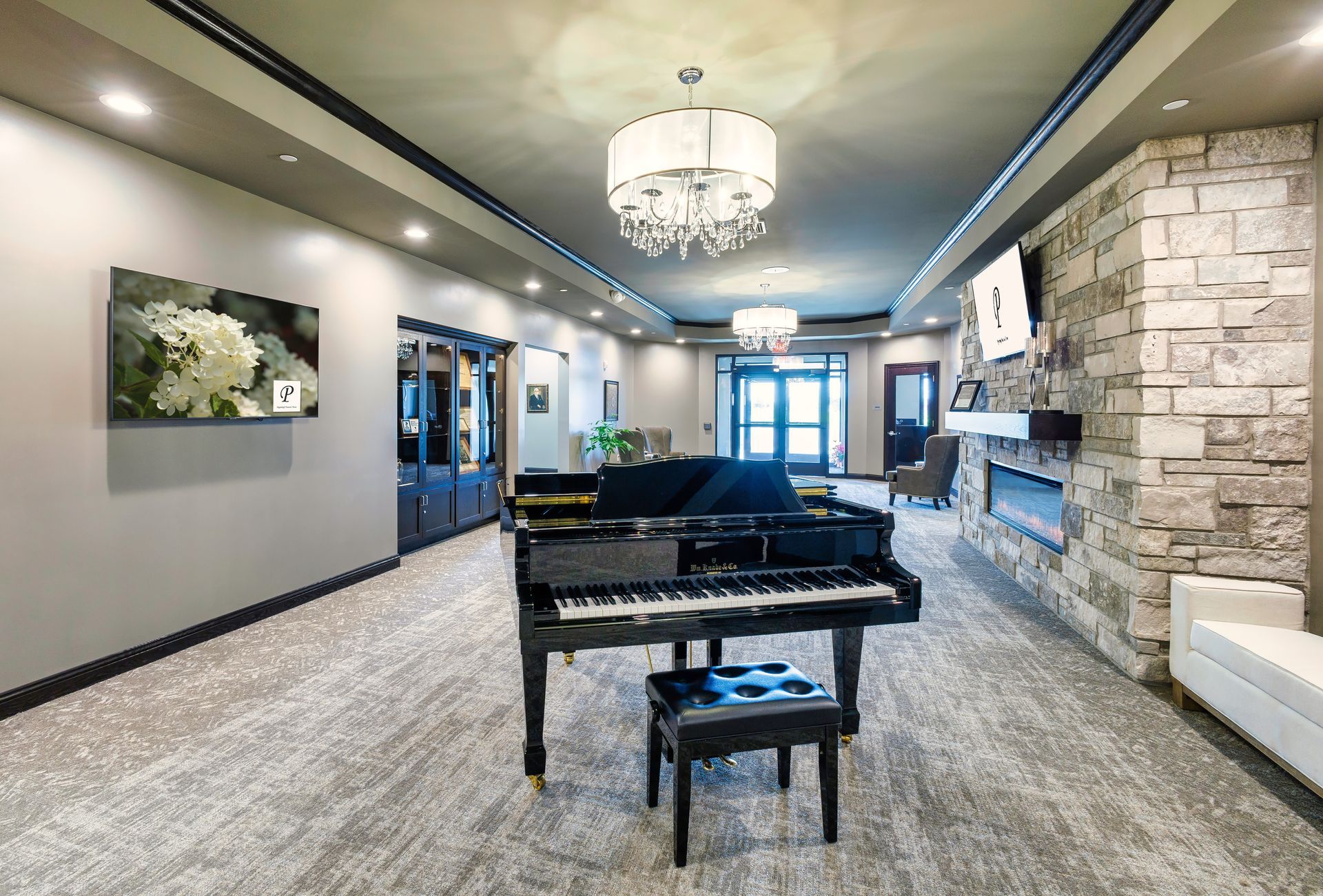 There is a piano in the middle of the room.