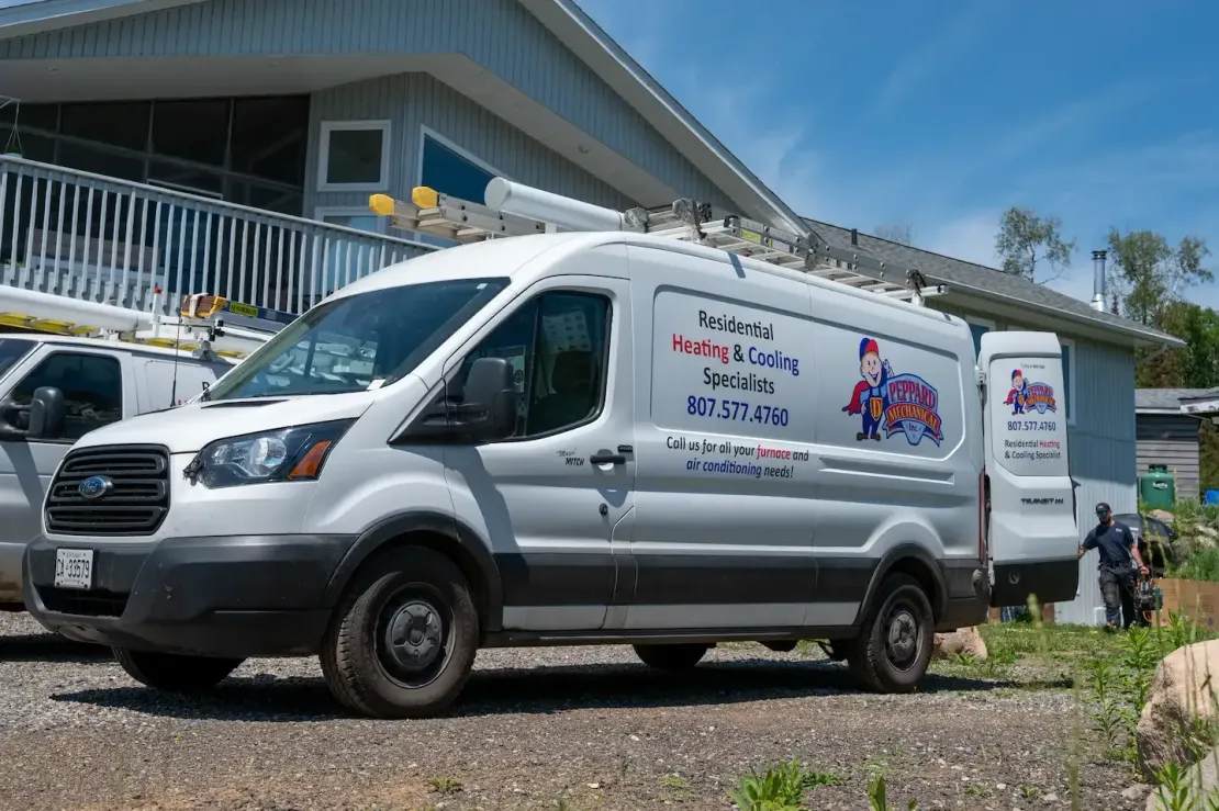 Technician fixing air conditioner and indoor unit beside a step ladder