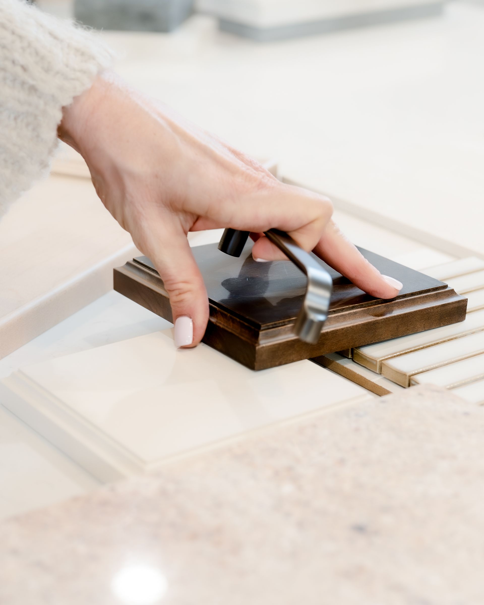 Close up of flooring and cabinetry samples. 