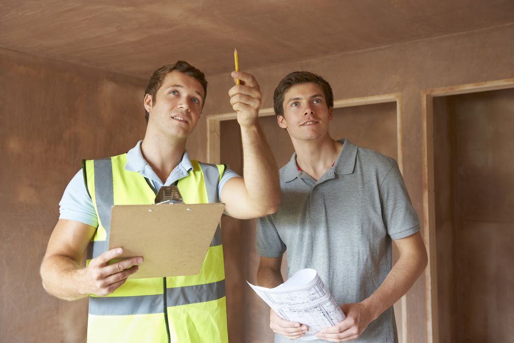 Two Men Standing Next To Each Other In A Room — Pro-Vision Property Inspections In Merewether, NSW