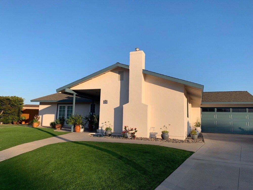 A house with a chimney on the side of it