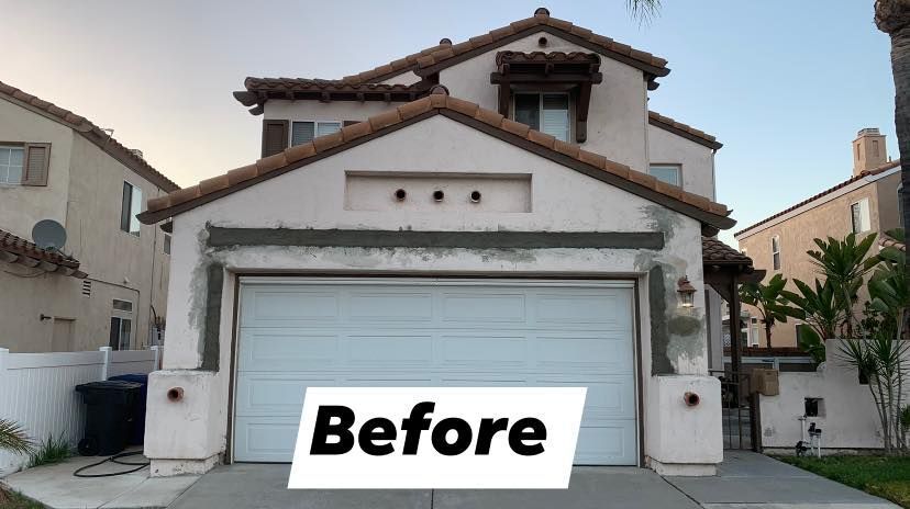 A before picture of a house with a white garage door.