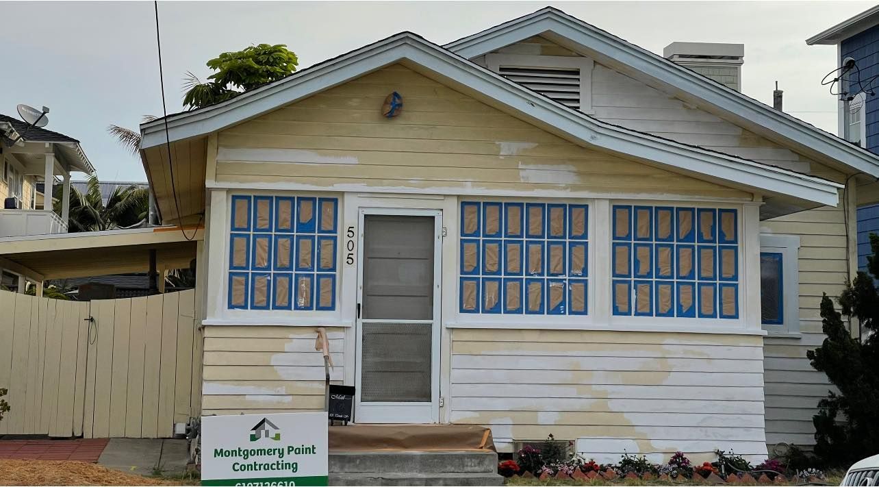 A small white house with blue windows is for sale.