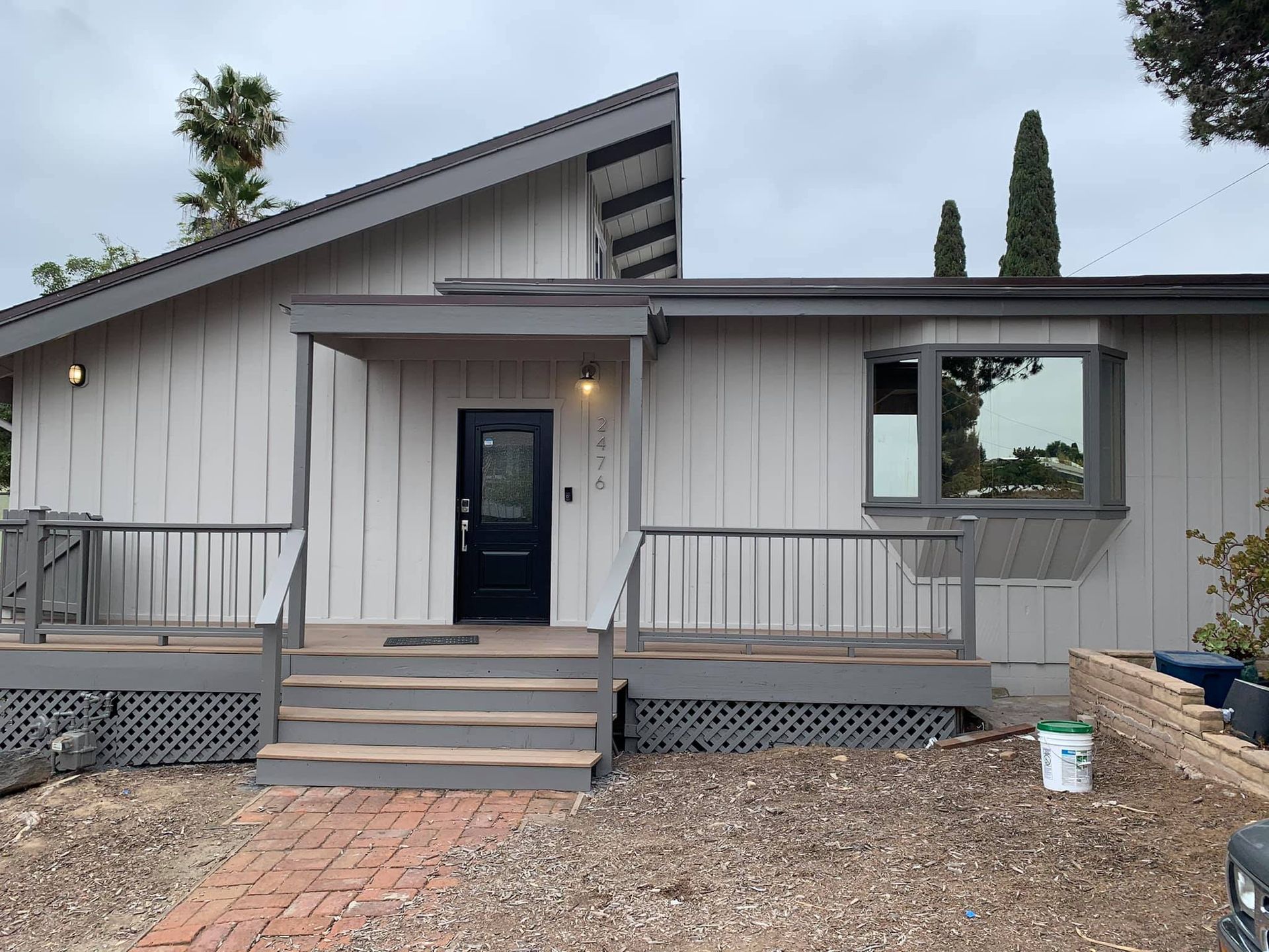 The front of a house with a porch and stairs