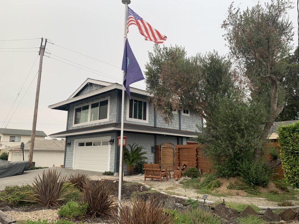 A house with a flag flying in front of it