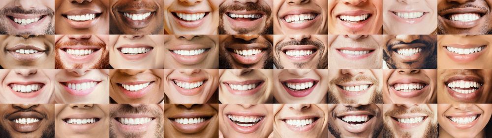 A collage of smiling faces of women of different races.