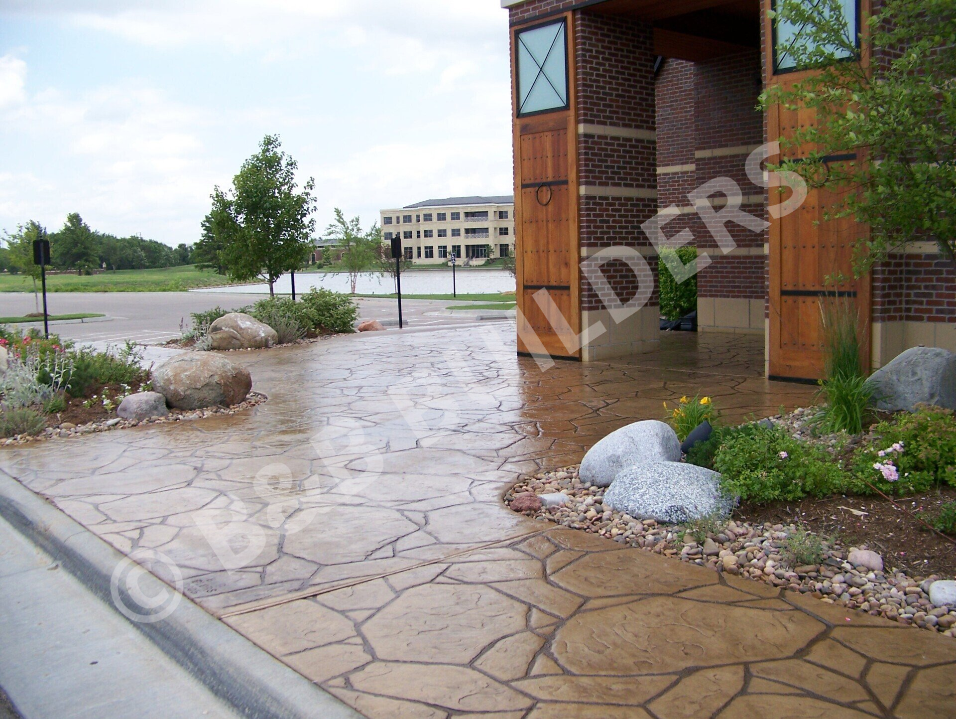 A  stamped concrete faux stone restaurant entryway