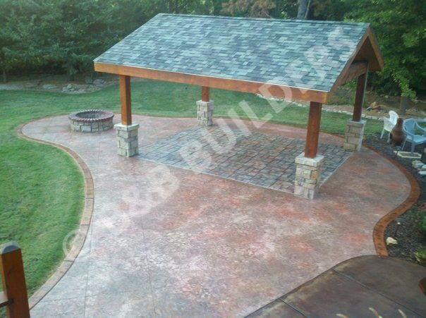 Stamped concrete patio with masonry firepit and covered area