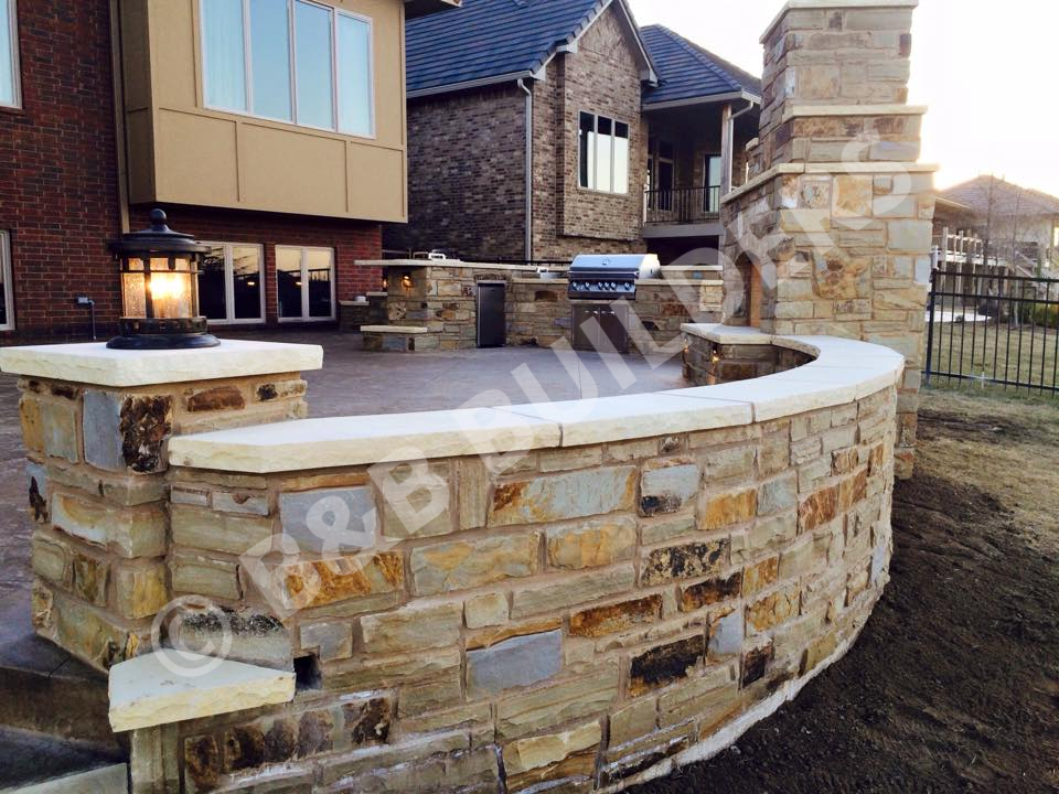Curved masonry wall with an outdoor fireplace
