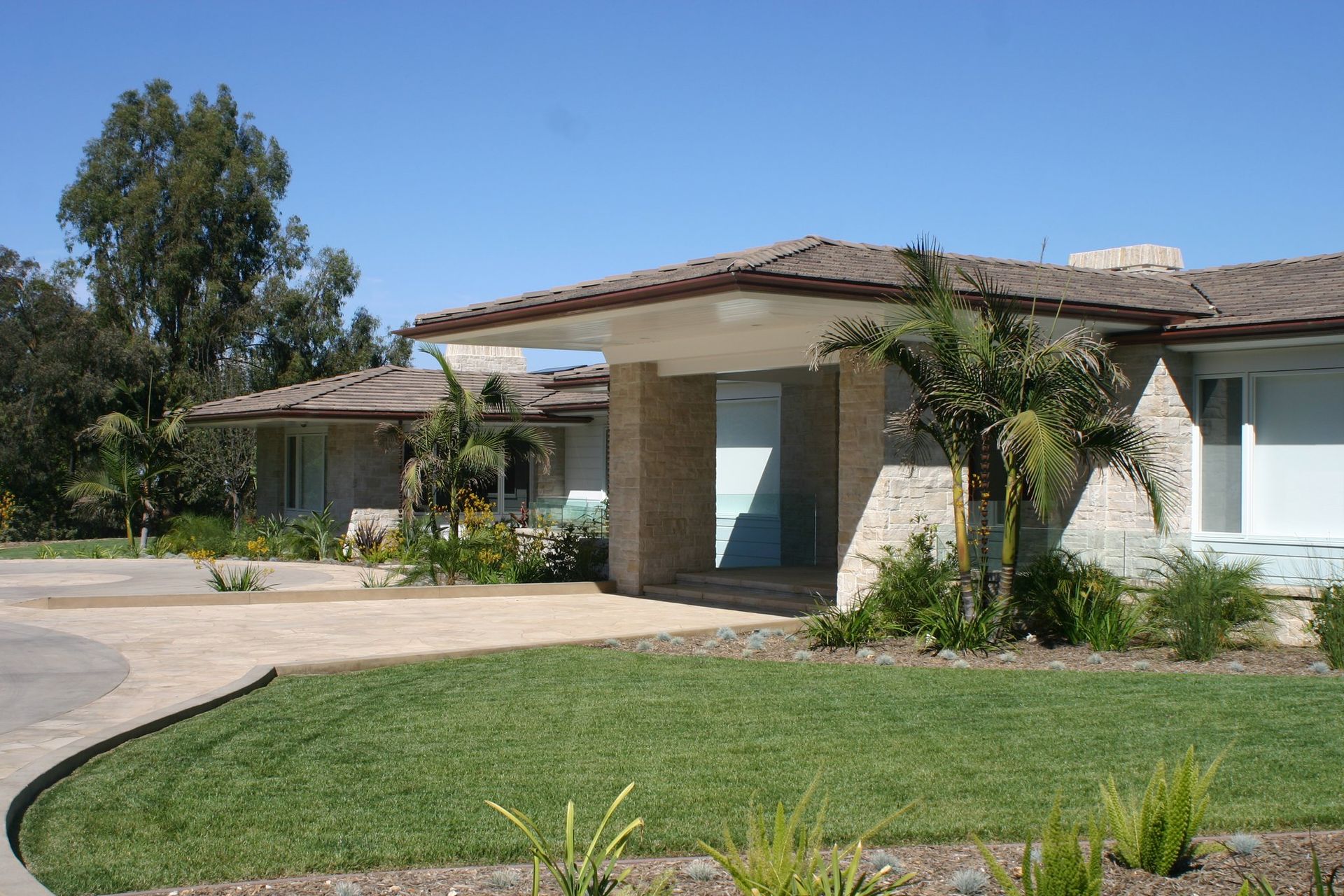 A house with palm trees in front of it