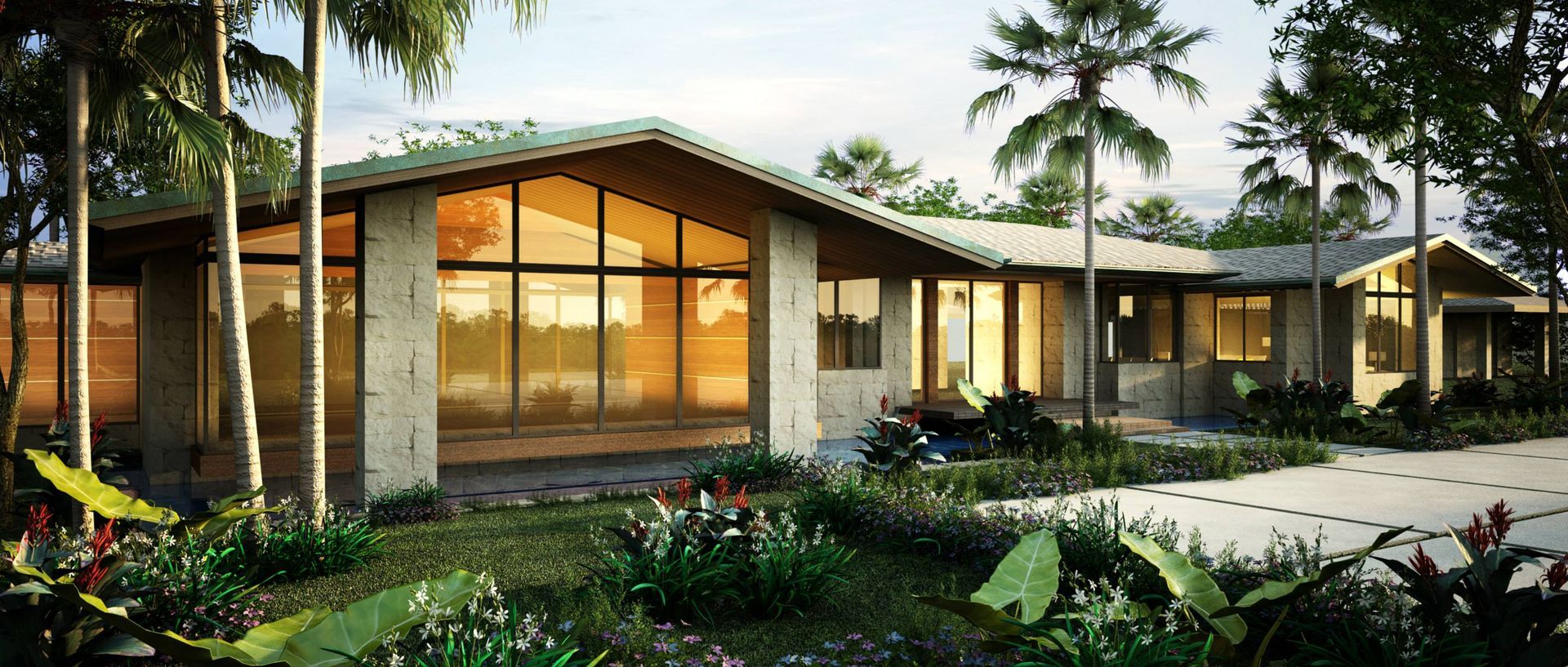 A large house with a lot of windows is surrounded by trees.
