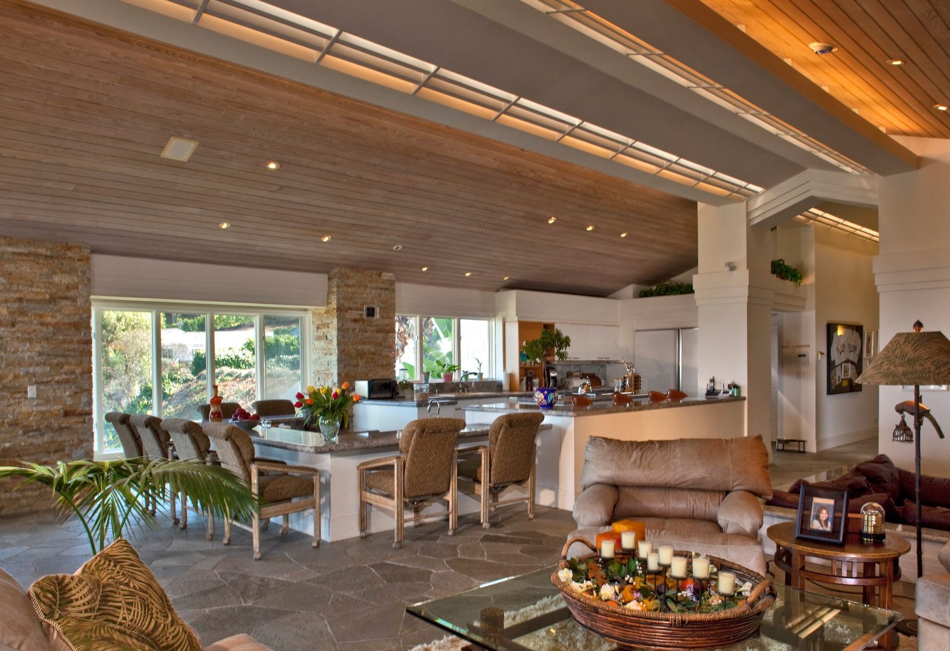 A living room with a couch a table and chairs