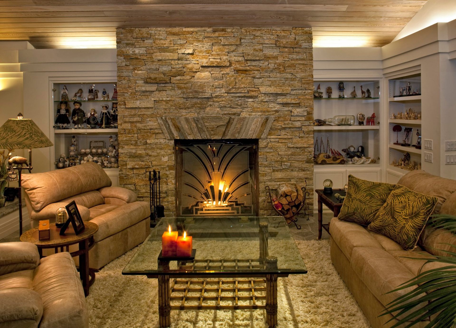A living room with a fireplace and a glass coffee table