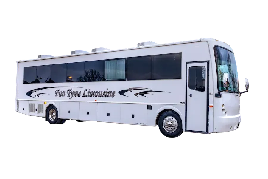 White party bus with tinted windows and decorative black swirls, labeled 