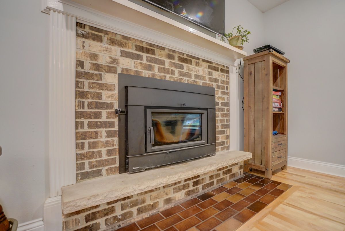 There is a fireplace in the middle of the room.