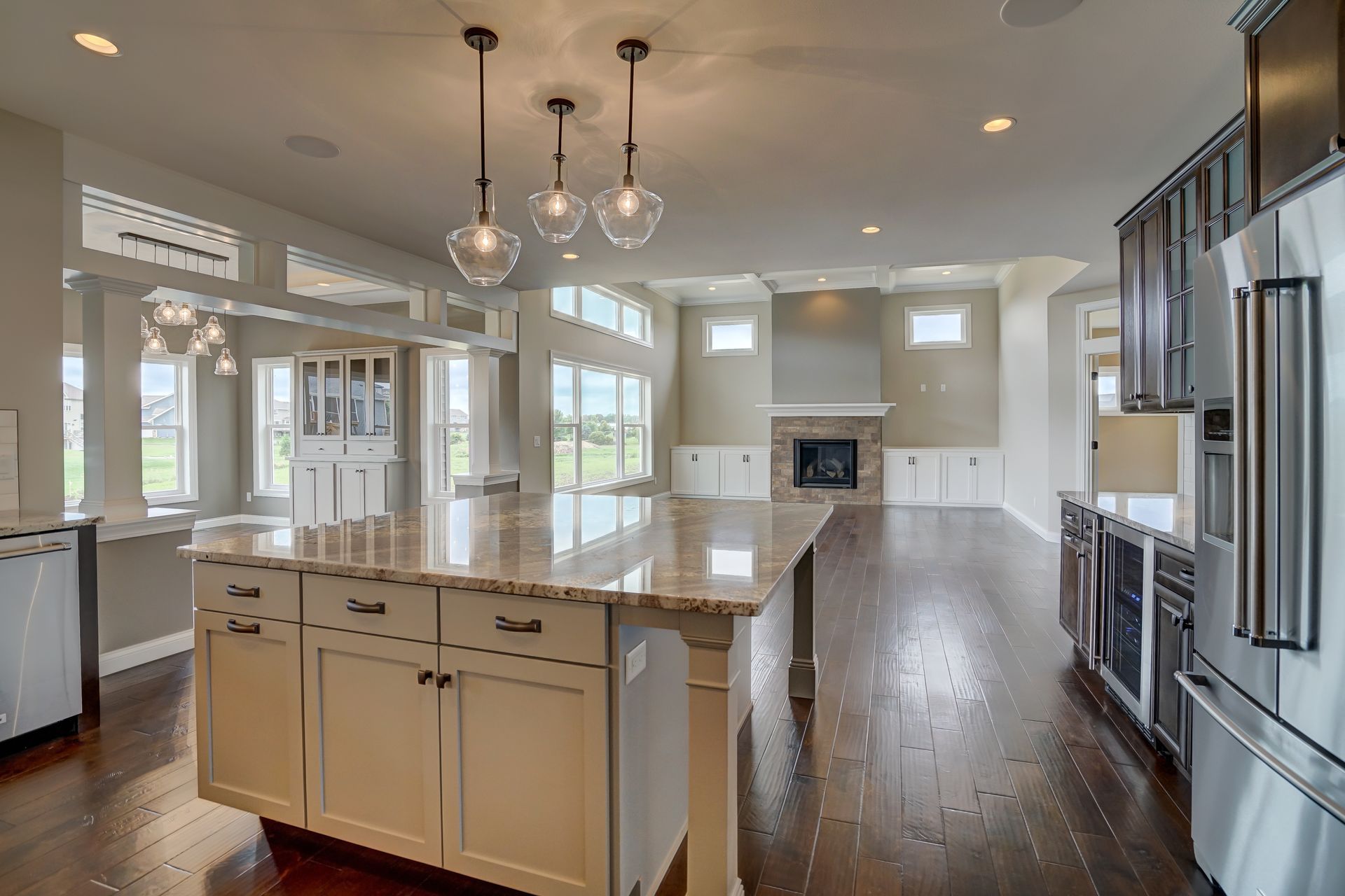 A kitchen with a large island and stainless steel appliances