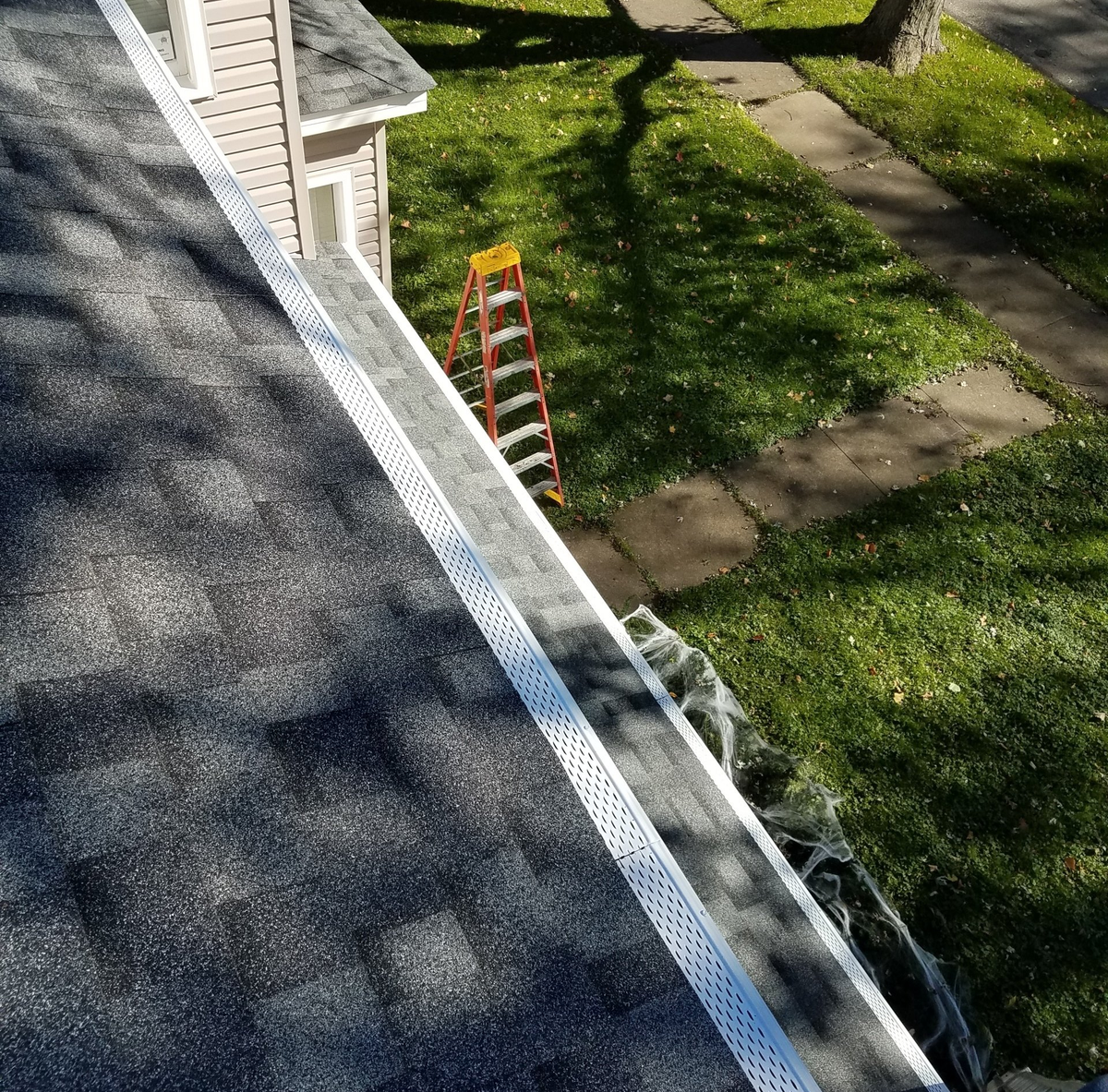 Roof Master with Electric Screwdriver — Aurora, IL — K&M Seamless Gutters