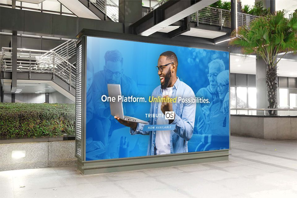 Billboard: Man holding a laptop smiles. Text reads 