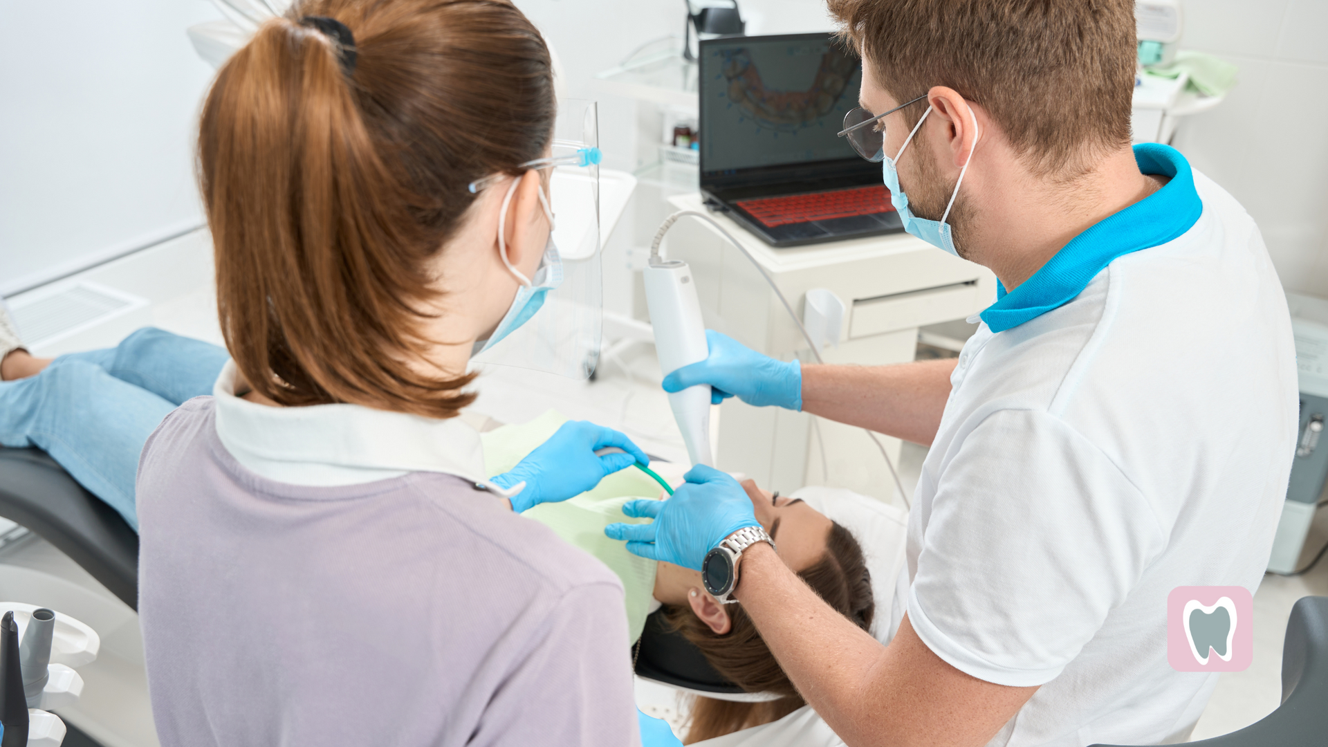 A dentist is examining a patient 's teeth in a dental office.