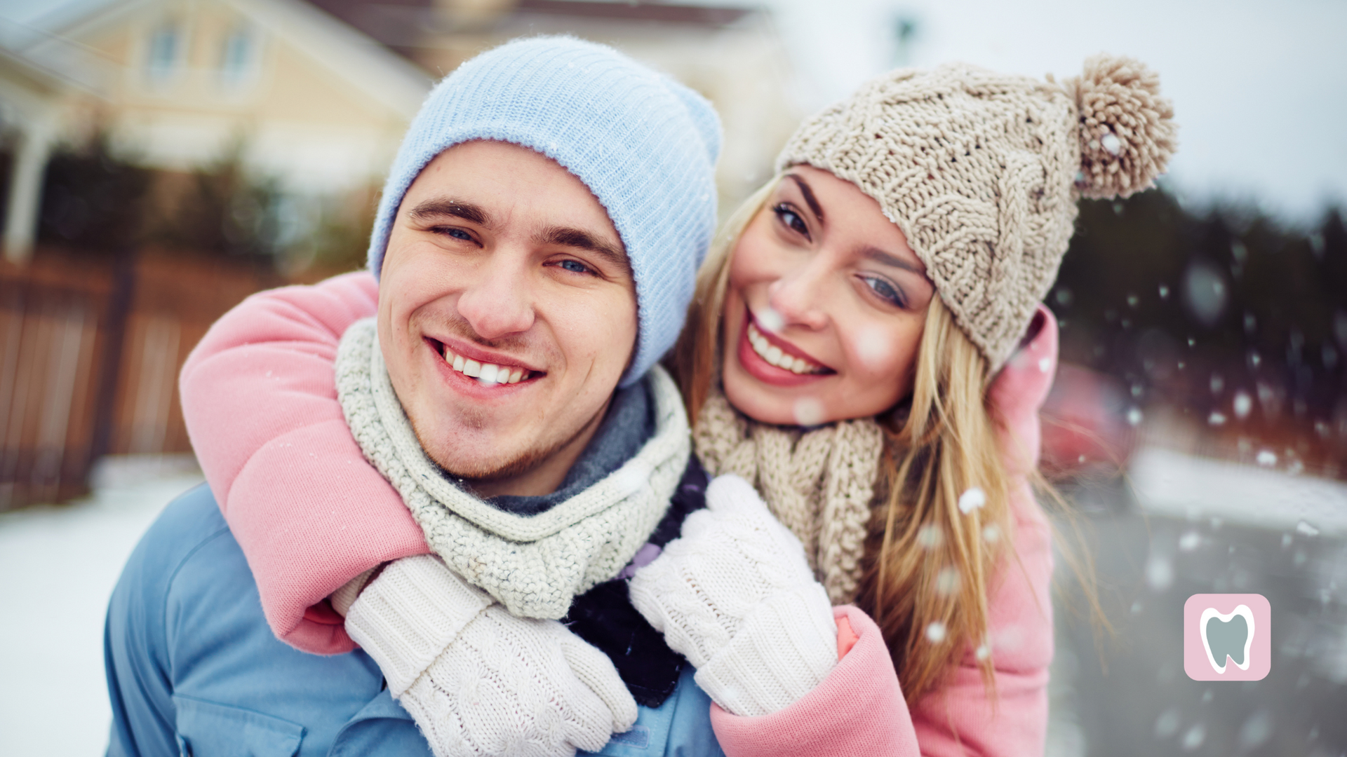 A man is carrying a woman on his back in the snow.