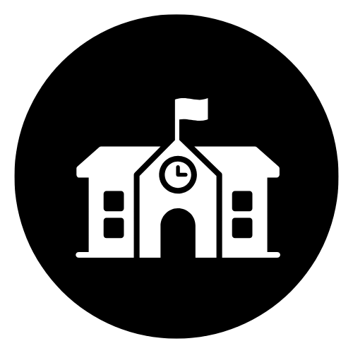 A school building with a clock and a flag on top of it.