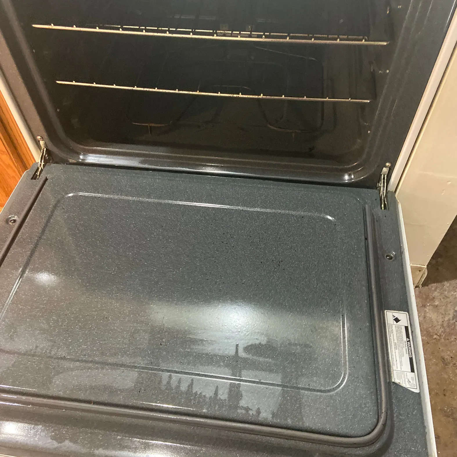 The inside of an oven with the door open