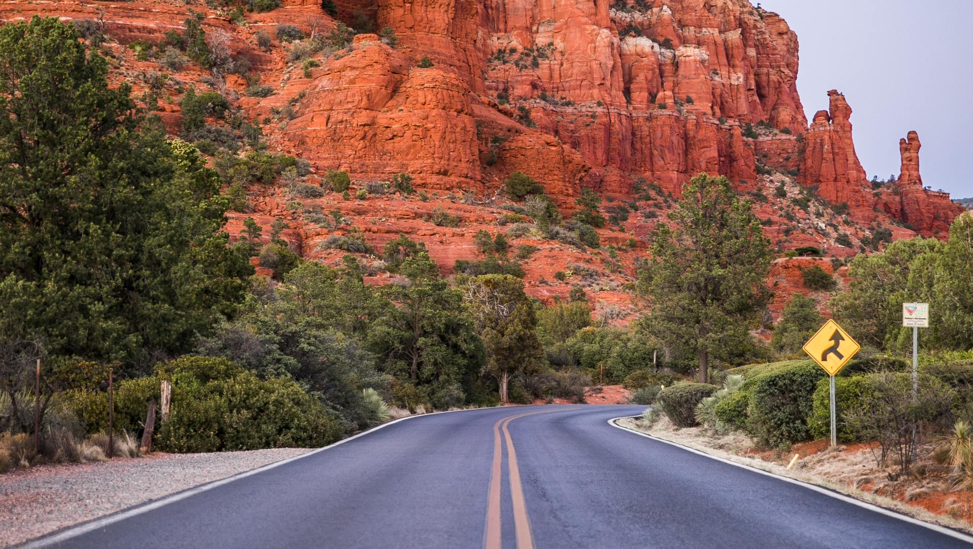 road going through red mountains