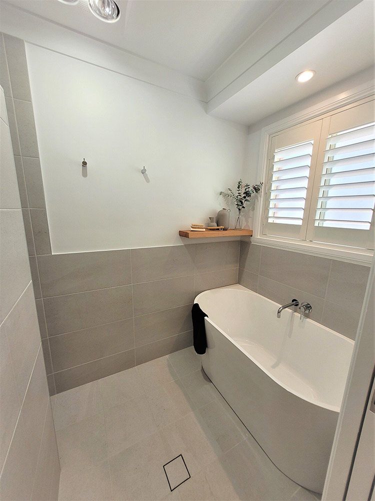 A Bathroom With A Bathtub And A Shower — Chandolin Construction In Robin Hill, NSW