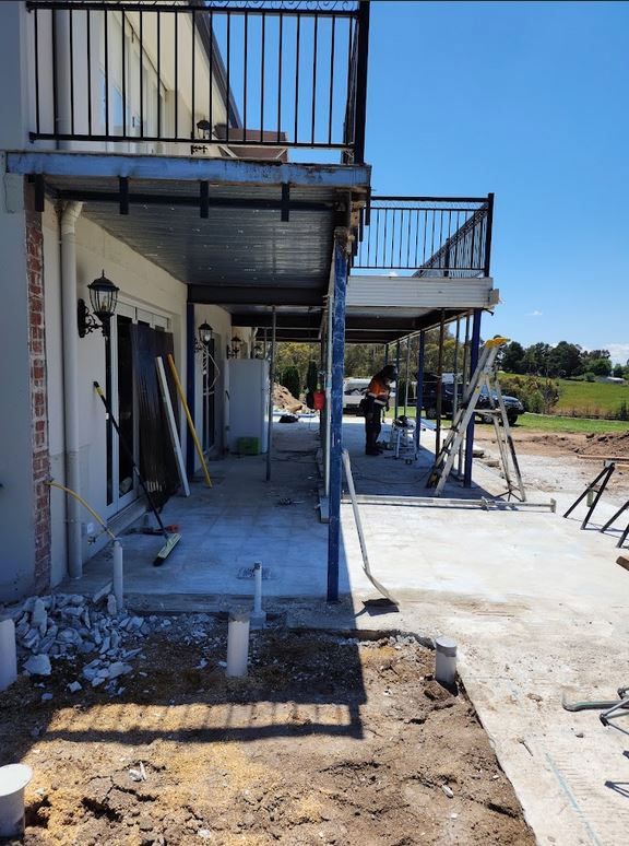 A Balcony Is Being Built On The Side Of A House — Chandolin Construction In Robin Hill, NSW