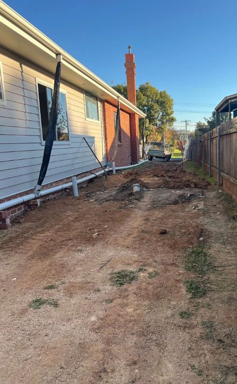 A House Is Being Built Next To A Dirt Road — Chandolin Construction In Robin Hill, NSW