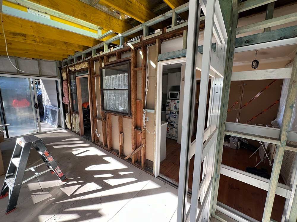 A Room In A House Under Construction With A Ladder In The Foreground — Chandolin Construction In Robin Hill, NSW