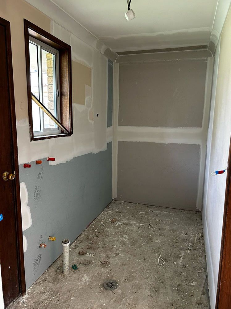 A Room With A Window And A Door Is Being Remodeled — Chandolin Construction In Robin Hill, NSW