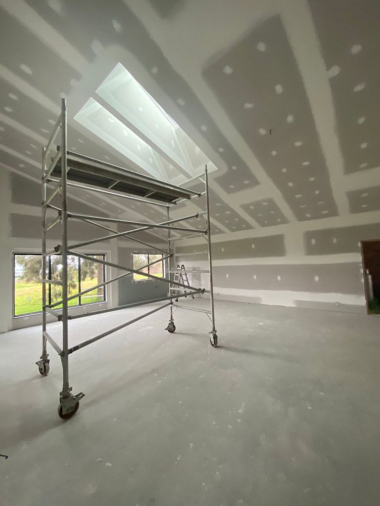 An Empty Room With A Scaffolding In The Middle Of It — Chandolin Construction In Robin Hill, NSW