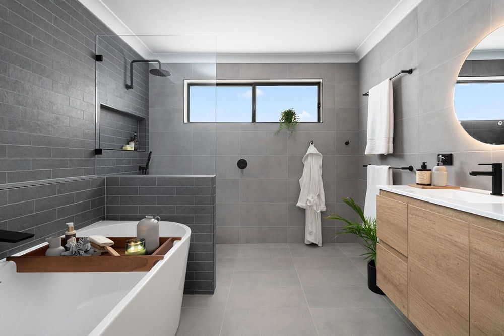 A Bathroom With A Bathtub And Sink — Chandolin Construction In Robin Hill, NSW