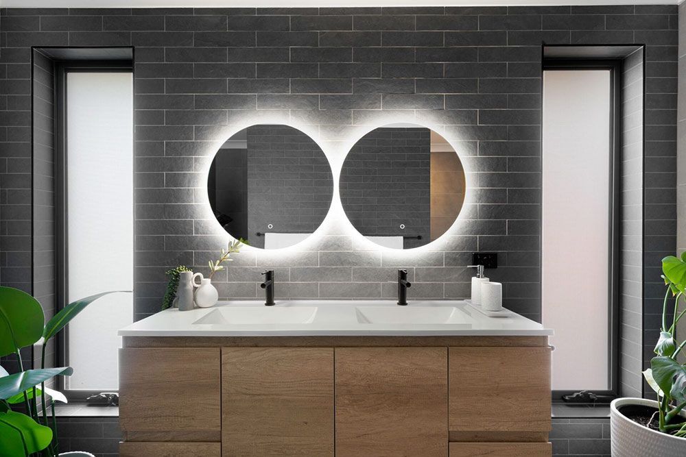 A Bathroom With Two Sinks And Two Mirrors — Chandolin Construction In Robin Hill, NSW