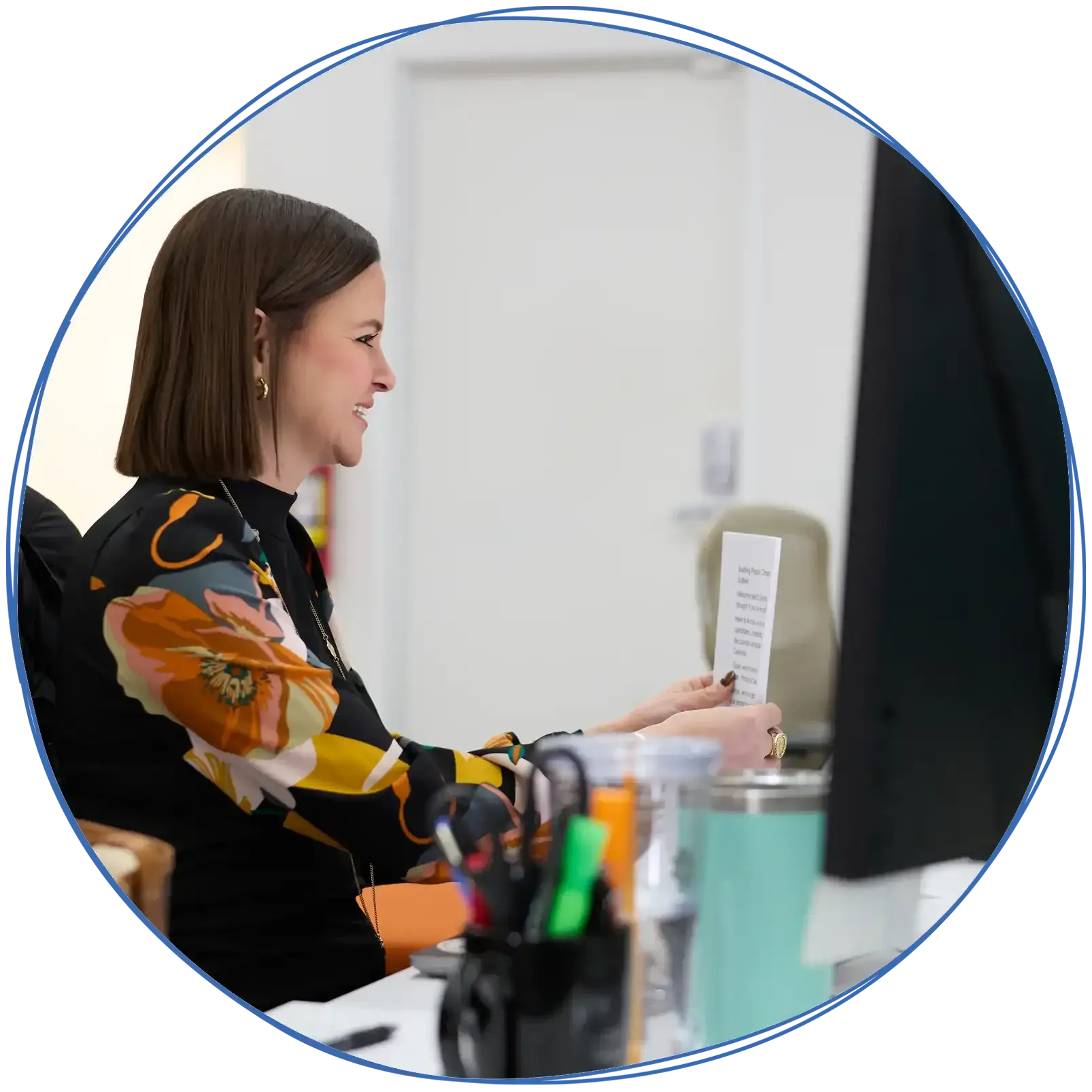 People in a business meeting around a table, using laptops and discussing ideas. Blue and white colors.