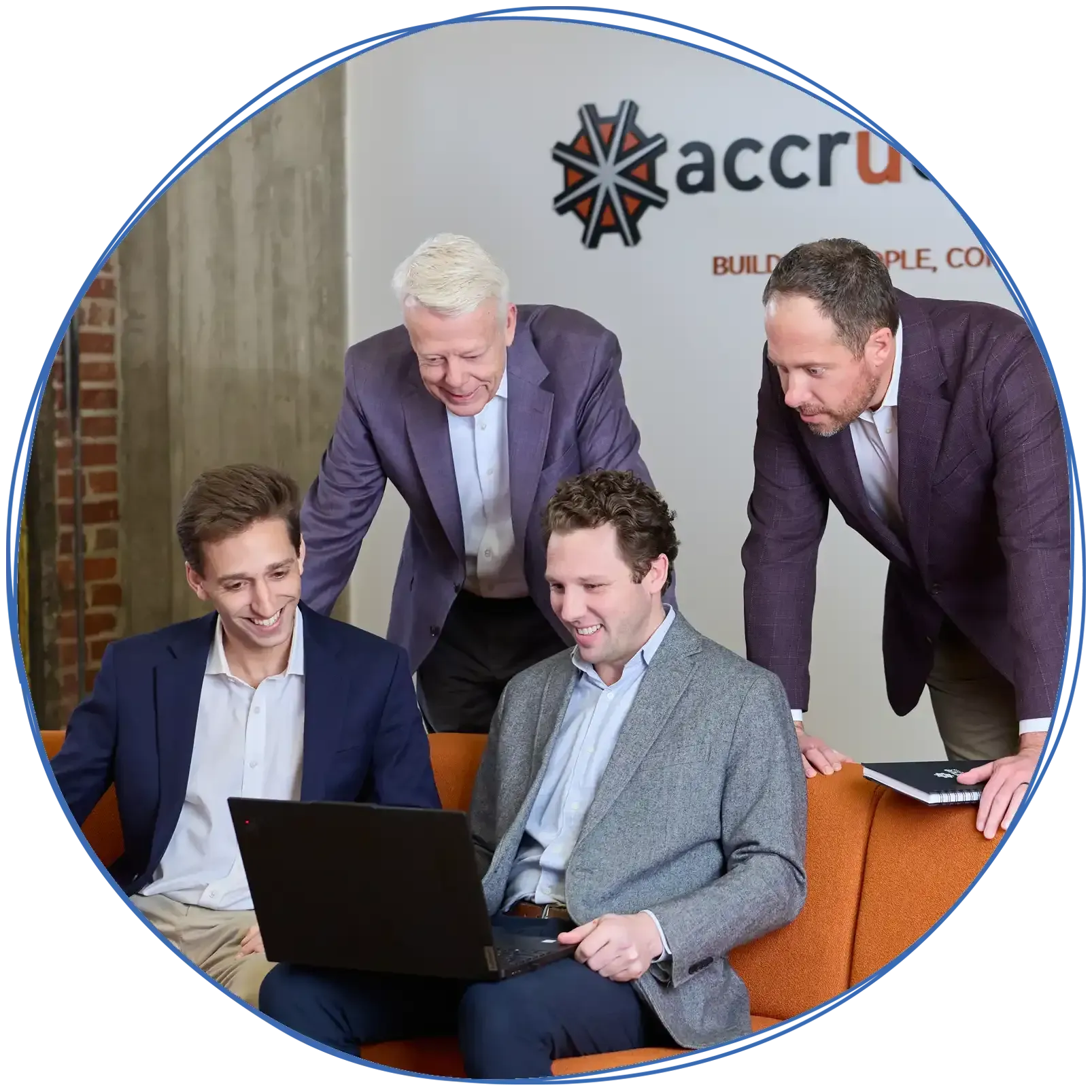 People in a business meeting around a table, using laptops and discussing ideas. Blue and white colors.