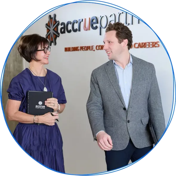 People in a business meeting around a table, using laptops and discussing ideas. Blue and white colors.